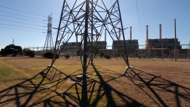 An electricity pylon stands in front of the decommissioned Hazelwood Power Station in the Latrobe Valley, Australia, on Saturday, Feb. 23, 2019. Australian Prime Minister Scott Morrison is pledging A$2 billion ($1.4 billion) over the next 10 years in direct action to lower greenhouse gas emissions, making a climate pitch to voters ahead of elections due by May. 