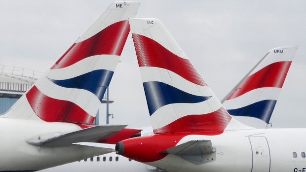 A British Airways aircraft, operated by British Airways Plc, prepares to take-off from the north runway at London Heathrow Airport, in this aerial photograph taken over London, U.K., on Tuesday, June 16, 2015. 