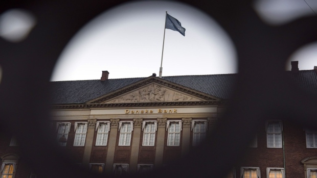A flag flies above the headquarters of Danske Bank A/S in Copenhagen, Denmark, on Tuesday, Sept. 18, 2018.