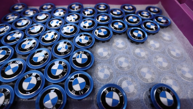 The BMW logo sits on a tray of wheel hub badges on the BMW i3 electric automobile assembly line at the Bayerische Motoren Werke AG factory in Leipzig, Germany, on Thursday, March 14, 2019. Chancellor Angela Merkel's plan to hatch a German battery-cell industry from scratch is gaining momentum as Europe's biggest economy tries to lower emissions while keeping Chinese automobile competition at bay. 
