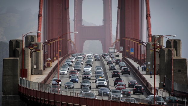 Vehicles travel on the Golden Gate Bridge during the morning commute in San Francisco, California, U.S., on Thursday, June 14, 2018. Last month, the Environmental Protection Agency and the National Highway Traffic Safety Administration proposed freezing fuel efficiency requirements for autos at 37 miles per gallon in 2020, instead of letting them rise to 47 mpg by 2025 under Obama-era regulations. 