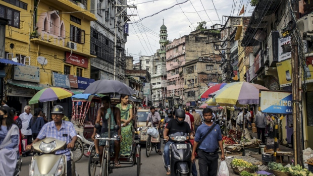 Traffic and pedestrian pass street stalls at Fancy Bazaar in Guwahati, Assam, India, on Saturday, Aug. 31, 2019. A sense of betrayal and anger is growing in Muslim communities, which are most affected by the National Register of Citizens that aims to separate genuine citizens from illegal migrants. Instead, the country’s biggest and most complex registry is dividing families and causing ripples across the political spectrum, fueled by concerns Prime Minister Narendra Modi's party is using the measure to advance a hardline Hindu agenda. 