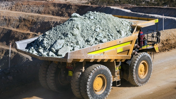 A truck carries nickel ore out of a open-cut nickel mine. 
