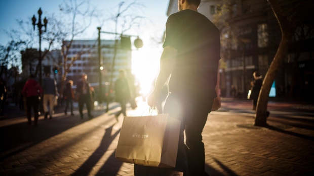 A pedestrian carries a Nike shopping bag in San Francisco. 
