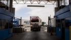 Truck drivers wait to speak to a U.S. Customs and Border Protection officer soon after arriving in the U.S. from Mexico at the Otay Mesa Port of Entry cargo facility in San Diego, California. 