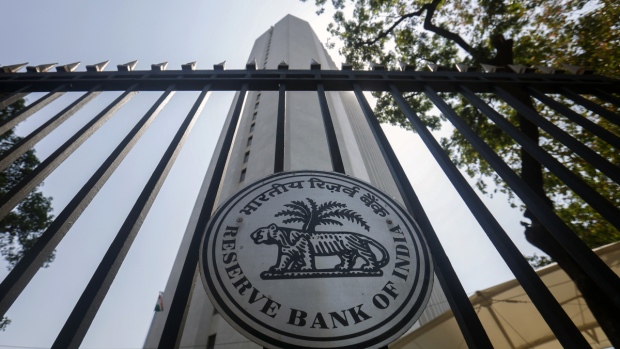 The Reserve Bank of India (RBI) logo is displayed on a gate at the central bank's headquarters in Mumbai, India, on Tuesday, April 1, 2014.