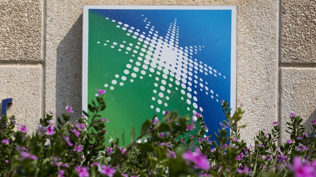 The logo of the Saudi Aramco oil company sits on display outside the Research and Development center at the company's compound in Dhahran, Saudi Arabia, on Wednesday, Oct. 3, 2018. Speculation is rising over whether Saudi Arabia will break with decades-old policy by using oil as a political weapon, as it vowed to hit back against any punitive measures after the disappearance of government critic Jamal Khashoggi. 