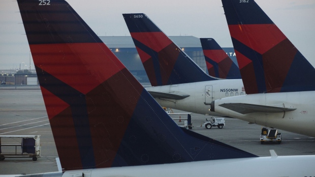 Delta Air Lines Inc. planes stand at Salt Lake City International airport (SLC) in Salt Lake City, Utah, U.S., on Friday, July 6, 2018. Delta Air Lines Inc. is scheduled to release earnings figures on July 12. 