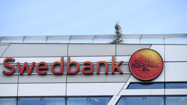A sign sits on the exterior of the Swedbank AB headquarters in Sundbyberg, Sweden, on Tuesday, March 5, 2019. Shares of Sweden’s oldest bank Swedbank have erased all the gains seen since Chief Executive Officer Birgitte Bonnesen took the helm of the bank in April 2016, after money-laundering allegations wiped out a fifth of its market value. 
