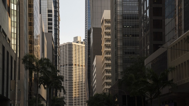 Commercial buildings stand in the central business district (CBD) in Singapore, on Friday, July 12, 2019. An unexpected contraction in Singapore’s economy and a slump in China’s exports sent a warning shot to the world economy as simmering trade tensions wilt business confidence and activity. 
