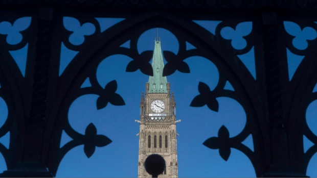 The Peace Tower is framed through a gate on Parliament Hill Thursday January 21, 2016 in Ottawa.  