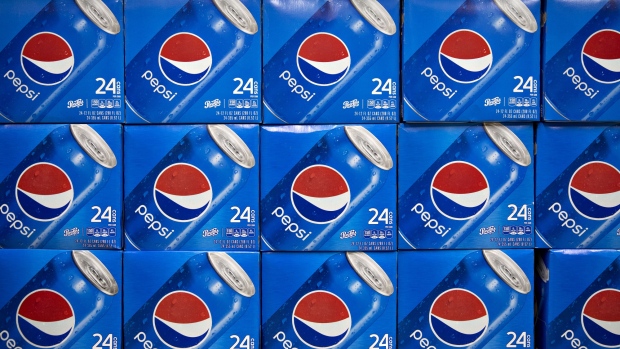 Cases of PepsiCo Inc. Pepsi brand soda sit on display for sale at a supermarket in Princeton, Illinois, U.S., on Wednesday, April 17, 2019. PepsiCo is getting a boost from some of its classic brands. The snack and beverage giant posted quarterly results that beat estimates, sending shares to the highest since at least 1980. 
