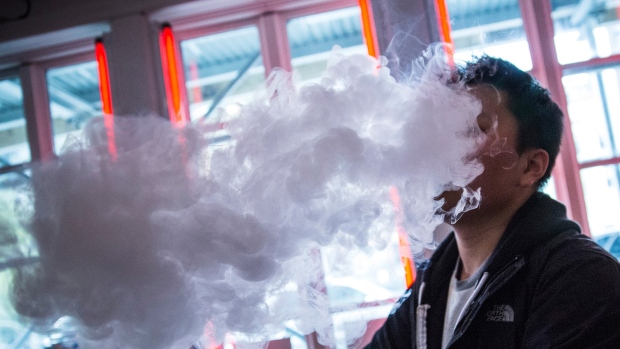 A man vapes in New York City. 