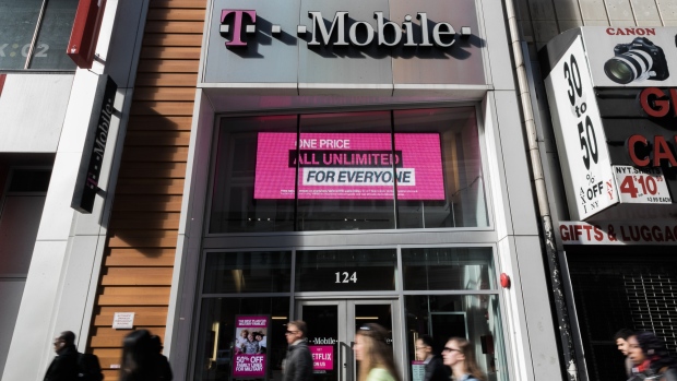 A Sprint Corp. logo is displayed on the exterior of a store location in New York, U.S. on Monday, April 30, 2018. Sprint Corp. suffered its worst stock decline in almost six months, rocked by fears that a proposed $26.5 billion takeover by T-Mobile US Inc. will get rejected by antitrust enforcers. 