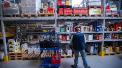 An employee collects customer orders inside a Metro AG wholesale food distribution depot in Weiterstadt, Germany, on Wednesday, April 25, 2018. Metro AG, the German food wholesaler, cut its profit and sales outlook for the year because of slowing business in Russia and higher costs to rejig the company after splitting off its consumer-electronics chain. 