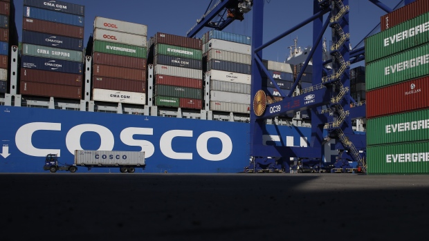 A container truck transports a China Ocean Shipping Group Company (COSCO) branded container at the terminal operated by Piraeus Container Terminal SA (PCT), at the Port of Piraeus, in Piraeus, Greece, on Saturday, Sept. 15, 2018. The trade route known in Beijing as the Belt and Road Initiative is spurring $1 trillion of investment on rail, highways and ports linking Europe and Asia. 