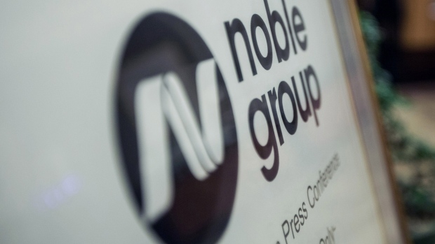 Noble Group Ltd. signage sits on display outside during an investor day in Singapore, on Monday, Aug. 17, 2015. Noble pledged to increase operating profit to more than $2 billion in the next three to five years as Asia\'s largest commodity trader sought to reassure investors about its long-term prospects. 