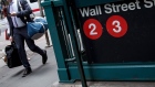 A pedestrian walks past the Wall Street subway station near New York Stock Exchange. 