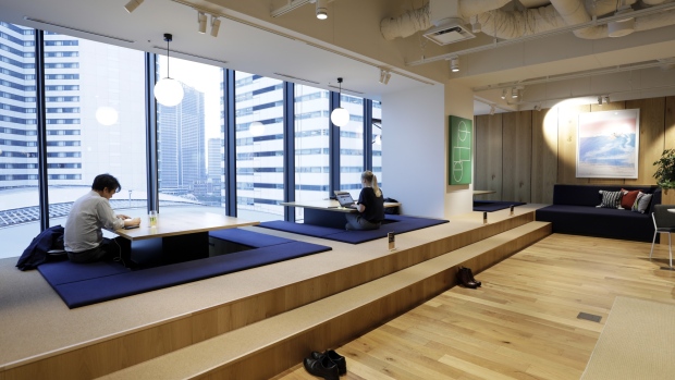 Members sit at low chabudai-style tables inside the WeWork Ocean Gate Minatomirai co-working office space, operated by The We Company, in Yokohama, Japan, on Friday, Oct. 11, 2019. WeWork formally withdrew the prospectus for an IPO this month, capping a botched fundraising effort that cost its top executive his job. The defeat places urgency on WeWork to find new sources of capital to keep its business running 
