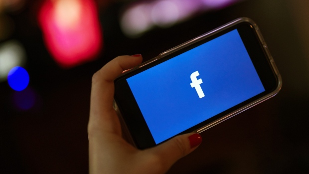 The Facebook Inc. logo is displayed on an Apple Inc. iPhone in this arranged photograph taken in the Brooklyn borough of New York, U.S., on Monday, April 23, 2019. As Facebook Inc. prepares to report first-quarter results Wednesday, analysts are confident that the social-media company has moved past negative headlines that dogged the stock throughout the second half of 2018 and is positioned to monetize its massive user base in new ways. 