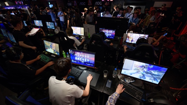 Attendees play Activision Blizzard Inc.'s Overwatch computer game at the AOC Open e-Sports event in Tokyo, Japan, on Saturday, July 1, 2017.