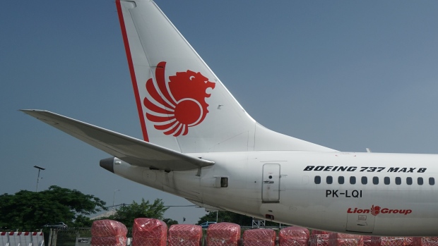 Aircraft stabilizers, left, sit on a grounded Lion Air Boeing Co. 737 Max 8 aircraft at Terminal One