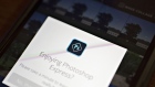 A logo is displayed in the Adobe Systems Inc. Photoshop Express application on an Apple Inc. iPhone