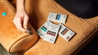 A person holds a Juul Labs Inc. e-cigarette next to packages of flavored pods in this arranged photograph taken in the Brooklyn Borough of New York, U.S., on Thursday, Dec. 20, 