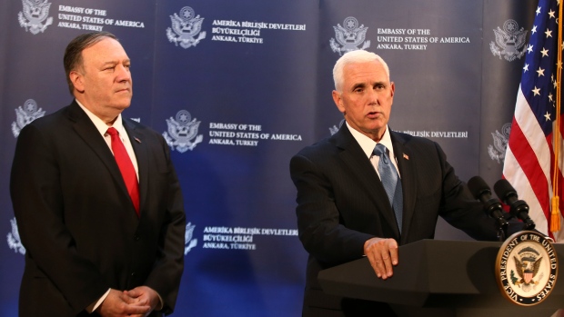 U.S Vice-president Mike Pence, right, talks to members of the media regarding his earlier meeting wi