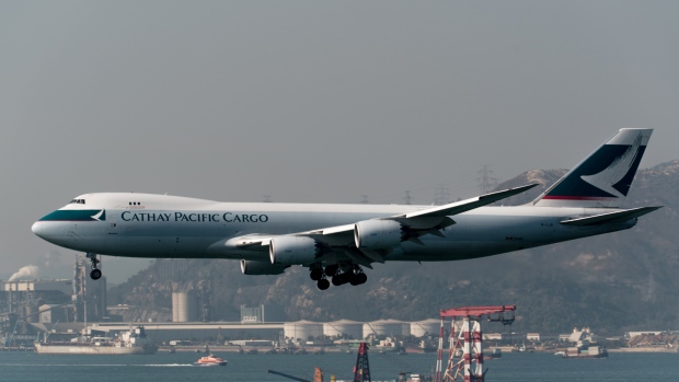A Boeing Co. 747-867 cargo aircraft operated by Cathay Pacific Airways Ltd. prepares to land at Hong Kong International Airport in Hong Kong, China, on Saturday, March 11, 2018. Cathay Pacific is expected to report a full-year net loss of HK$2.7 billion ($345 million) for 2017, after a first-half deficit of HK$2.05 billion, according to the median estimate in a Bloomberg News survey of five analysts. 