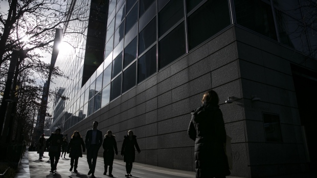 Pedestrians pass in front of Goldman Sachs Group Inc. headquarters in New York, U.S., on Wednesday, Dec. 19, 2018. Equities are the place to be in 2019, according to a senior money manager at Goldman Sachs Asset Management. The company, which says it oversees more than $1 trillion, is betting that global growth will extend into next year, giving support to stock fundamentals. 