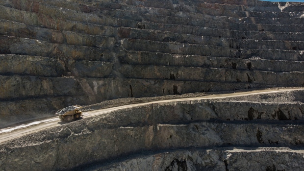 A dump truck travels along a ramp in an open pit mine at the Oyu Tolgoi copper-gold mine, jointly ow