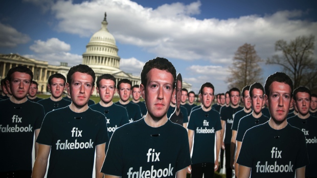 Cutouts of Facebook CEO Mark Zuckerberg are displayed on the South East lawn of the Capitol building ahead of testimony before a joint hearing of the Senate Judiciary and Commerce Committees in Washington, D.C., U.S., on Tuesday, April 10, 2018. Lawmakers will grill Zuckerberg on issues ranging from the troves of data vacuumed up by app developers and political consultant Cambridge Analytica to Russian operatives' use of the social network to spread misinformation and discord during the 2016 U.S. presidential election. 