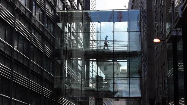 LONDON, ENGLAND - OCTOBER 10: A man walks across a footbridge linking two buildings at the Goldman Sachs investment offices on October 10, 2016 in London, England. A number of global investment giants have threatened to move their European operations out of London if Brexit proves to have a negative impact on their businesses. (Photo by Carl Court/Getty Images) 