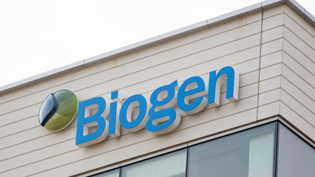 Signage is displayed outside of the Biogen Inc. headquarters in Cambridge, Massachusetts, U.S., on Wednesday, Oct. 21, 2015. Biogen Inc. will fire 11 percent of its workforce and shut down some research programs in order to put money behind existing drugs and what it sees as its best future bets. 