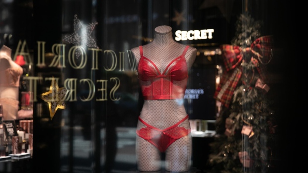 Signage is reflected on a window display of a Victoria's Secret Stores LLC store, a subsidiary of L Brands Inc., in New York, U.S., on Wednesday, Nov. 14, 2018. Victoria's Secret has been under scrutiny for failing to keep up with shifting consumer demands, especially involving themes of female empowerment and diversity. 