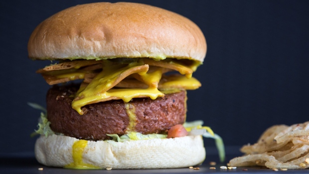 A "my way" burger, made with a Beyond Meat Inc. plant-based burger patty, sits on the kitchen pass r