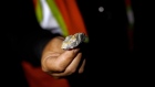 A worker displays a rock with gold at the Agnico Eagle Mines Ltd. Meliadine site in Rankin Inlet, Nu