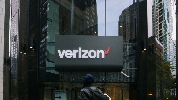 A pedestrian passes in front of a Verizon Communications Inc. store in Chicago, Illinois, U.S., on Tuesday, Oct. 22, 2019. Verizon Communications is scheduled to release earnings figures on October 25. 