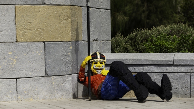 A reclining model guard, made out of Lego bricks, stands on display at the Legoland Dubai theme park