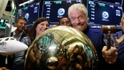 Sir Richard Branson, founder of Virgin Galactic, rings a ceremonial bell on the floor of the New Yor