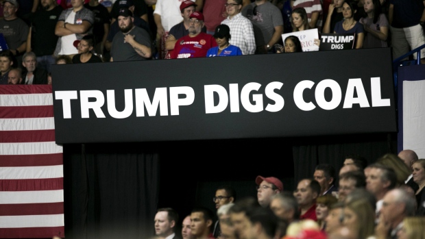 A banner reading "Trump Digs Coal" is displayed during a rally with U.S. President Donald Trump, not pictured, in Charleston, West Virginia, U.S., on Tuesday, Aug. 21, 2018.