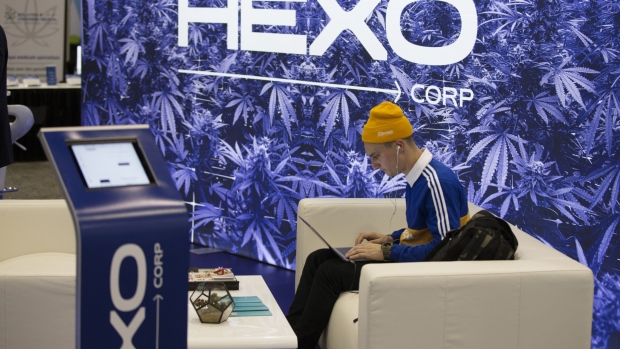 An attendee uses a laptop at the Hexo Corp. booth during the Montreal Cannabis Expo in Montreal, Que