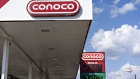Signage is displayed at a Conoco gas station in Peoria, Illinois, U.S.