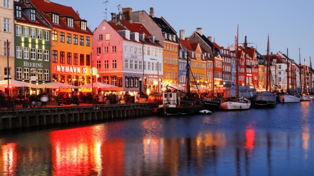 Residential and commercial properties stand on the bank of the canal in the Nyhavn district of central Copenhagen, Denmark.