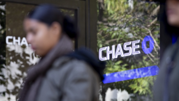 A pedestrian walks past a JPMorgan Chase & Co. bank branch in Chicago, Illinois, U.S., on Saturday, Oct. 12, 2019. JPMorgan Chase & Co. is scheduled to release earnings figures on October 15. 