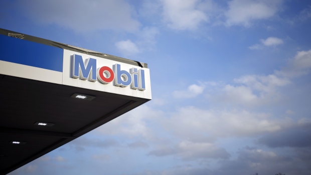 Signage is displayed at an Exxon Mobil Corp. gas station in Columbus, Indiana, Jan. 29, 2019.