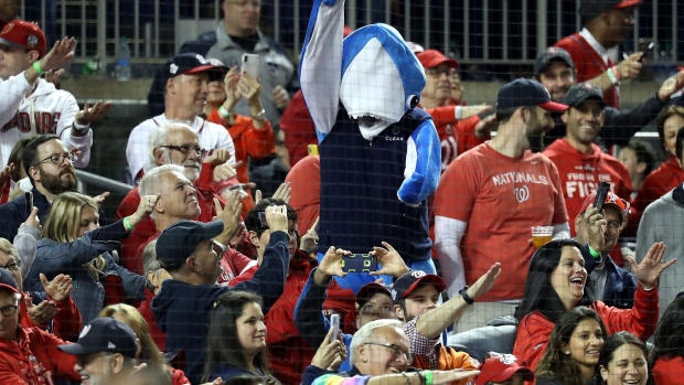 WASHINGTON, DC - OCTOBER 25: Fans take part in the "Baby Shark" song as Gerardo Parra (not pictured) of the Washington Nationals comes up at bat against the Houston Astros during the sixth inning in Game Three of the 2019 World Series at Nationals Park on October 25, 2019 in Washington, DC. (Photo by Rob Carr/Getty Images)