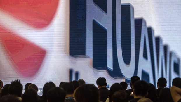 Huawei Technologies Co. signage is displayed on a screen during a product launch event at Huawei's Executive Briefing Center in Beijing, China, on Wednesday, May 15, 2019. Huawei overtook Apple Inc. to claim the No. 2 spot in global smartphone sales in the first quarter, second only to Samsung Electronics Co. 