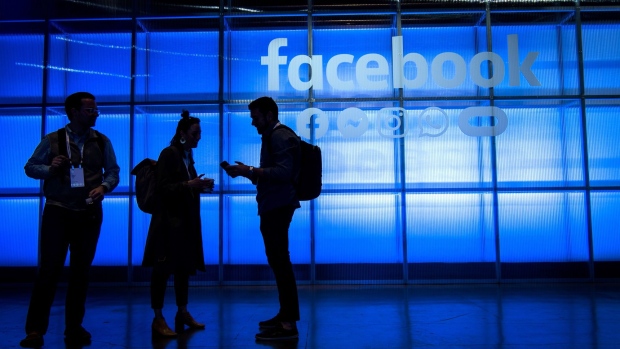 Attendees stand in the demonstration room during the F8 Developers Conference in San Jose, California, U.S., on Tuesday, April 30, 2019. Facebook Inc. unveiled a redesign that focuses on the Groups feature of its main social network, doubling down on a successful but controversial part of its namesake app and another sign that Facebook is moving toward more private, intimate communication. 